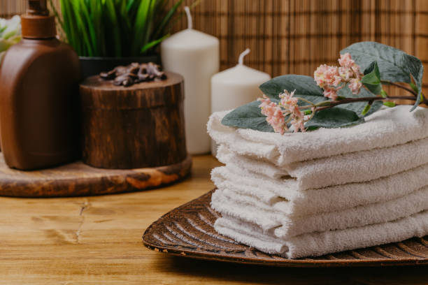istock Spa still life with aromatic candles, flower and towel. - Image 1125287473