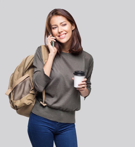 istock Happy young student girl talking on smart phone 1125289766