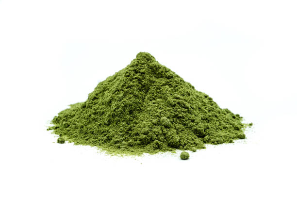 Barley grass powder isolated on white Background Barley grass powder isolated on white Background chlorella stock pictures, royalty-free photos & images