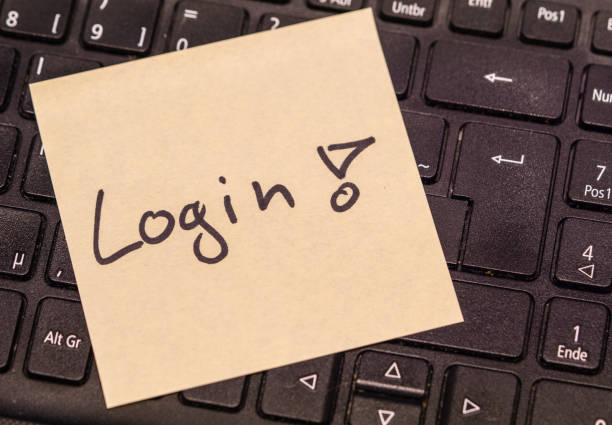 istock Slip on keyboard lying written with login 1125292099