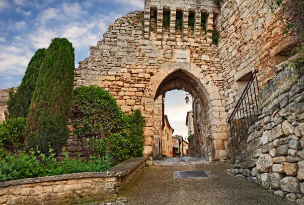 Lacoste, Vaucluse, Provence, France: The Portal de la Garde, ancient city gate at the entrance to the old town of the picturesque medieval village
