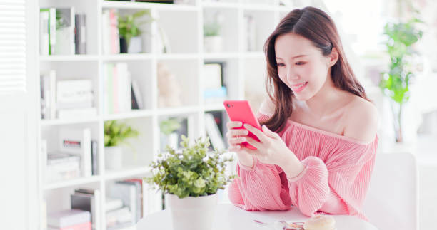 istock asian woman use smart phone 1125301410