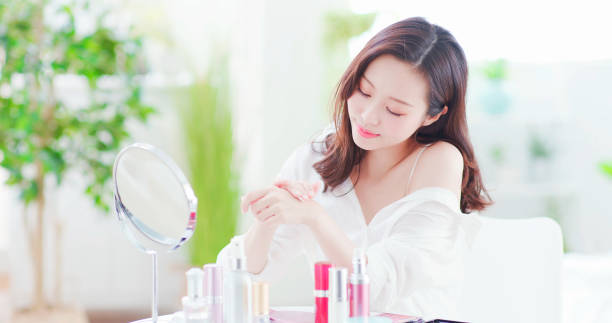 istock asian woman applying hand cream 1125301589