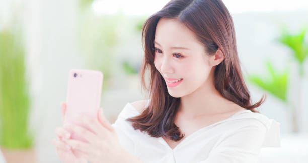 istock asian woman take a selfie 1125301810