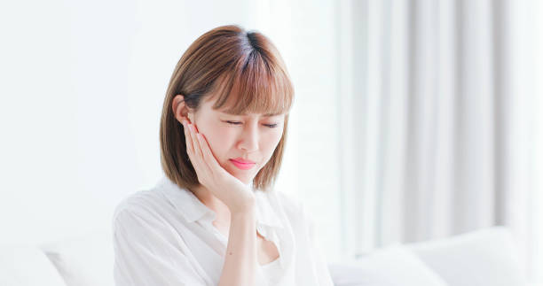 woman feel pain on teeth stock photo