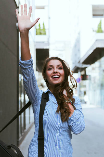 istock Businesswoman Waving 1125302159