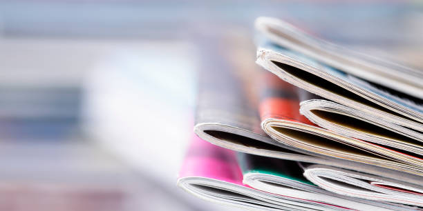 Close-up photograph of a stack of old magazines stock photo