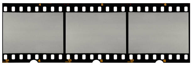 long film strip, blank photo frames, free space for your pictures, real high-res 35mm film strip scan with signs of usage on white background - usage imagens e fotografias de stock