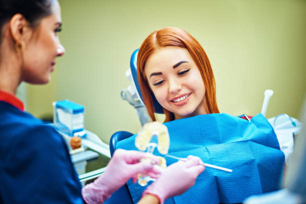 istock Dentist examining a patient's teeth in the dentist. 1125303660