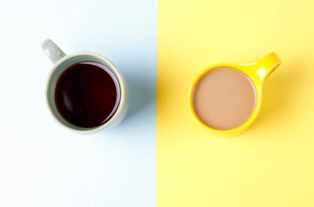 istock Cup of coffee, tea on a on a yellow and blue background, top view 1125305342