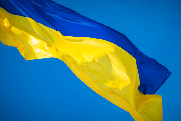 istock Ukrainian flag on sky background 1125305567