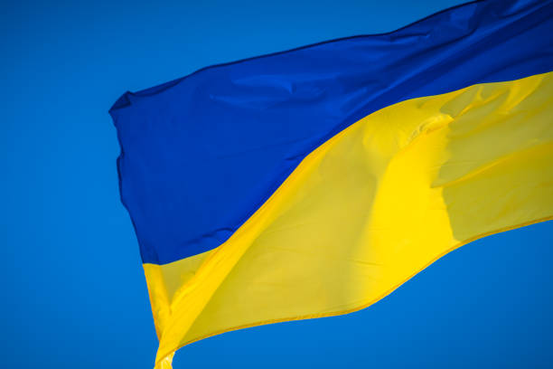 istock Ukrainian flag on sky background 1125305686
