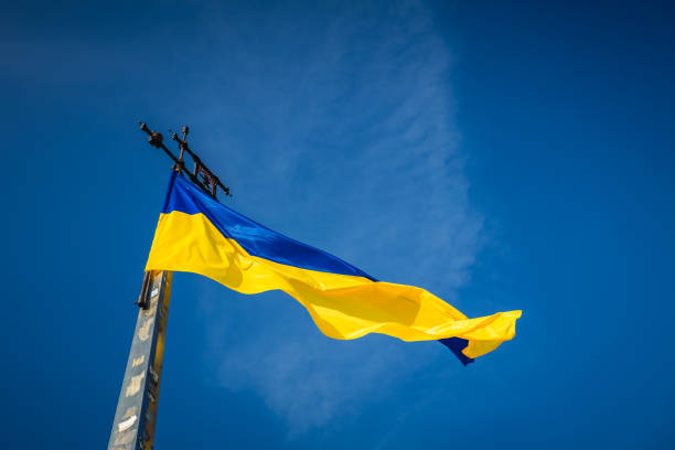 istock Ukrainian flag on sky background 1125305699