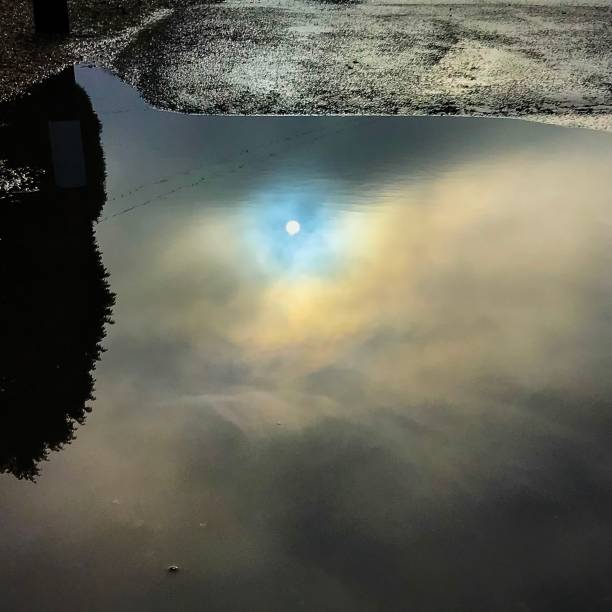 istock Reflection of the sun in a puddle 1125308712