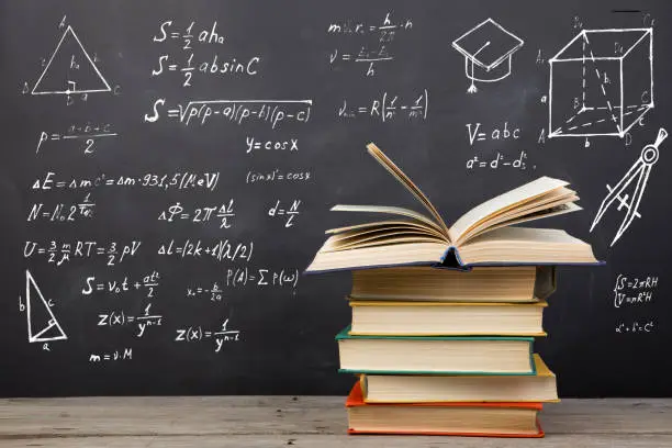 Photo of Education concept - books on the desk in the auditorium