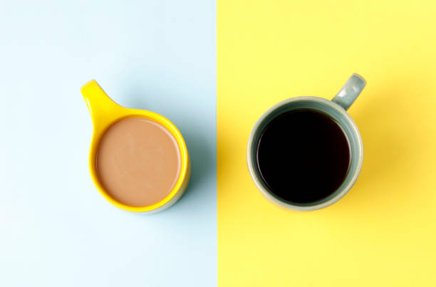istock Cup of coffee, tea on a on a yellow and blue background, top view 1125310264