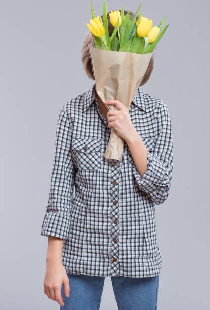 istock Girl with flowers 1125310399
