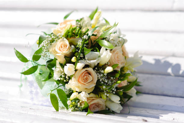istock Bouquet of a bride on a white bench. Beautiful wedding bouquet. 1125310521