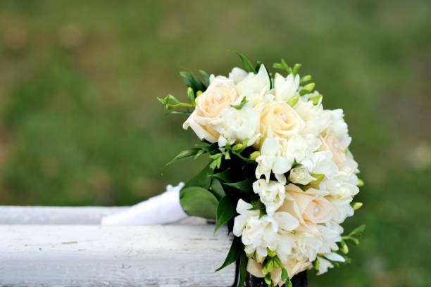 istock Bouquet of a bride on a white bench. Beautiful wedding bouquet. 1125310562