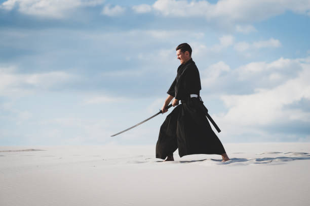 istock Man training martial arts in desert 1125312277