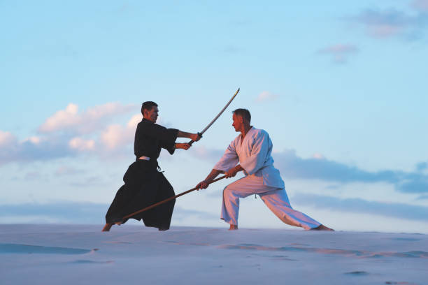 istock Concentrated men, in Japanese clothes, are practicing martial arts 1125312327