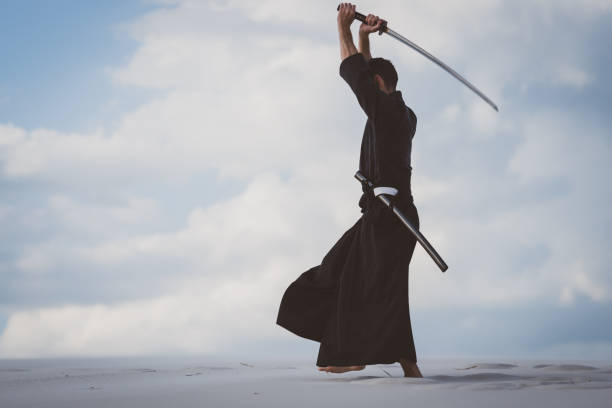 istock Man training martial arts in desert 1125312332