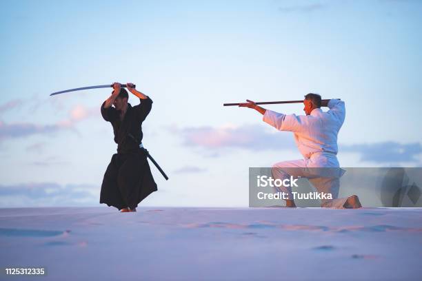 Concentrated Men In Japanese Clothes Are Practicing Martial Arts Stock Photo - Download Image Now
