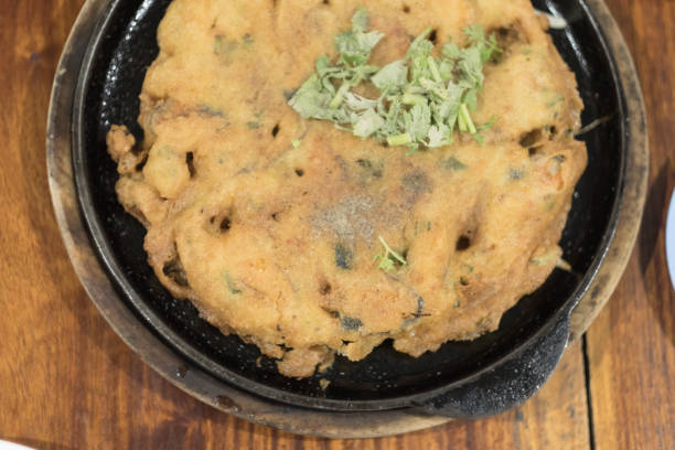 istock Crispy Thai Mussel Omelet served on hot pan, top view 1125317374
