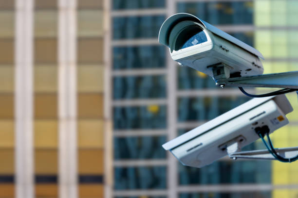 istock security CCTV camera or surveillance system with buildings on blurry background 1125319987