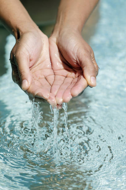 istock Clear water in woman hands 1125321292