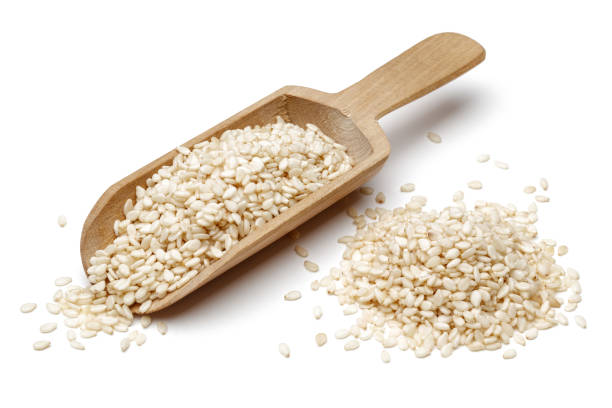 istock White sesame seeds and wooden spoon 1125329762