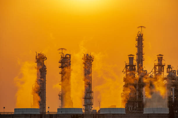 istock steam and clouds from industry in sunset 1125330832