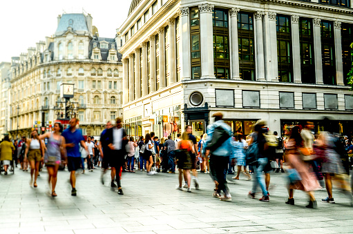 A busy street scene with crowds of motion blurred people in London's west end