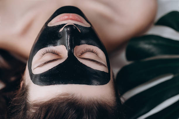istock Woman with purifying black mask 1125340288