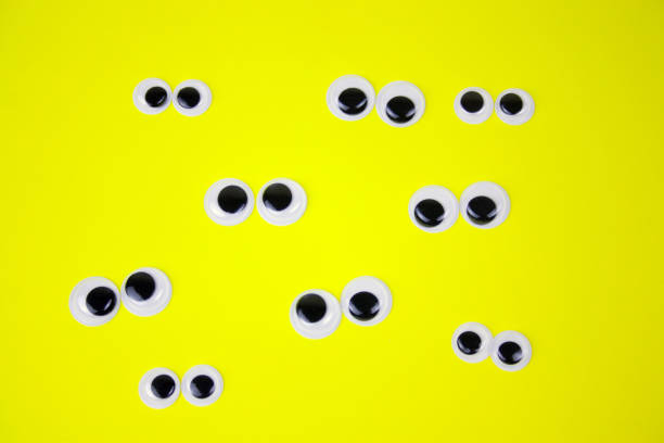istock googly eyes on yellow pastel background 1125340956