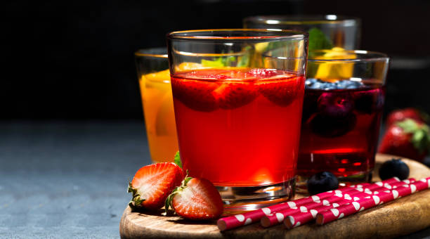 istock fruit and berry beverages in assortment on dark background 1125341903
