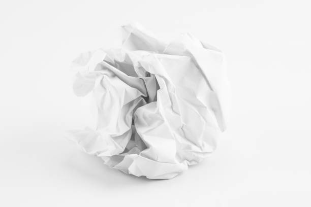 istock Crumpled paper balls on agray background 1125342932