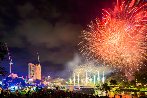 Adelaide, Australia - January 26, 2019: Australia Day celebration with fireworks on display in the city viewed across Torrens river at night