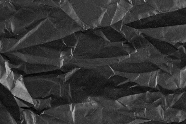 istock Abstract background crumpled plastic film texture black garbage bag 1125344408