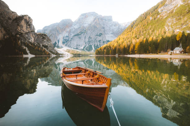 istock Traditional rowing boat on a lake in the Alps in fall 1125345635