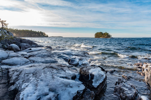 istock Icy stones on beach near lake Vattern 1125345706