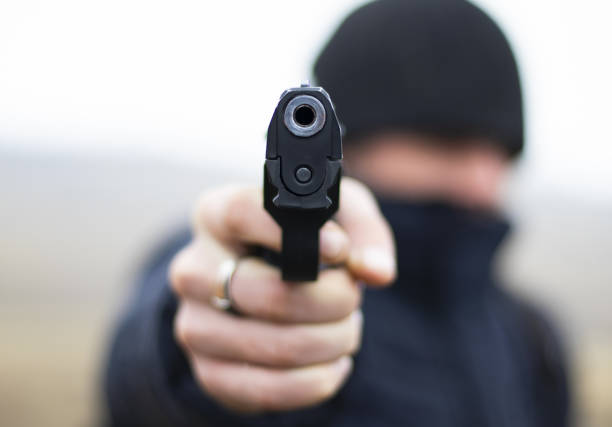 istock Gun in hand close-up 1125346372