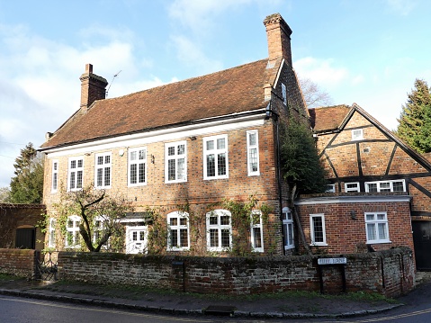 Station Road, Tring, Hertfordshire, England - November 3nd 2023:  Facade of a typical English townhouse in two stocks