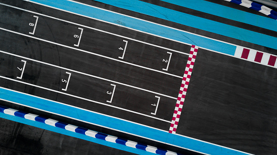 High angle view of numbers of finish lane of blue running track, Berlin Charlottenburg