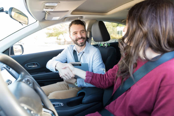 istock Giving Self Introduction With A Handshake In Car 1125351335