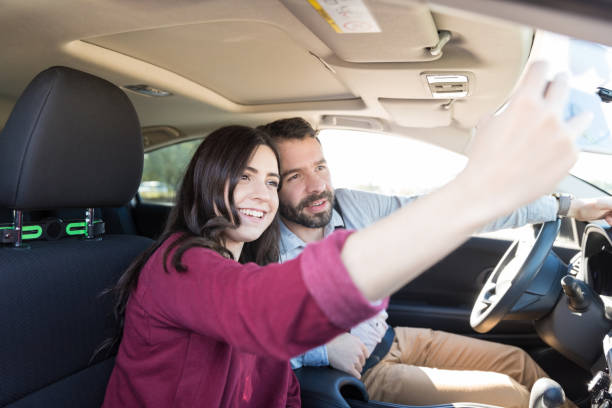 istock Happy Lovers Capturing Memories In Car 1125351399