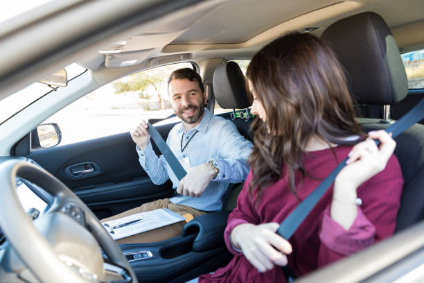 istock Instructor And Student Fastening Car Seatbelts 1125351598
