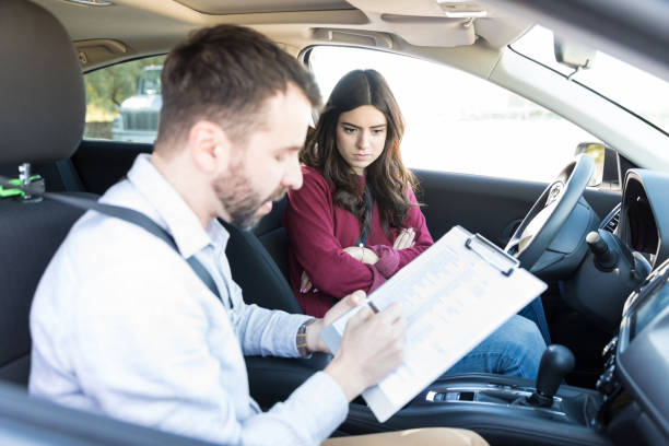 istock Instructor Failing Student For Her Bad Drive 1125351621