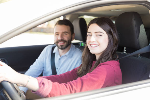 istock Smiling Woman Enjoying Car Ride With Man 1125352555