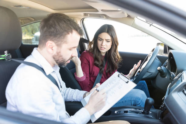 istock Woman Showing Disapproval In Driving Test Results 1125353726
